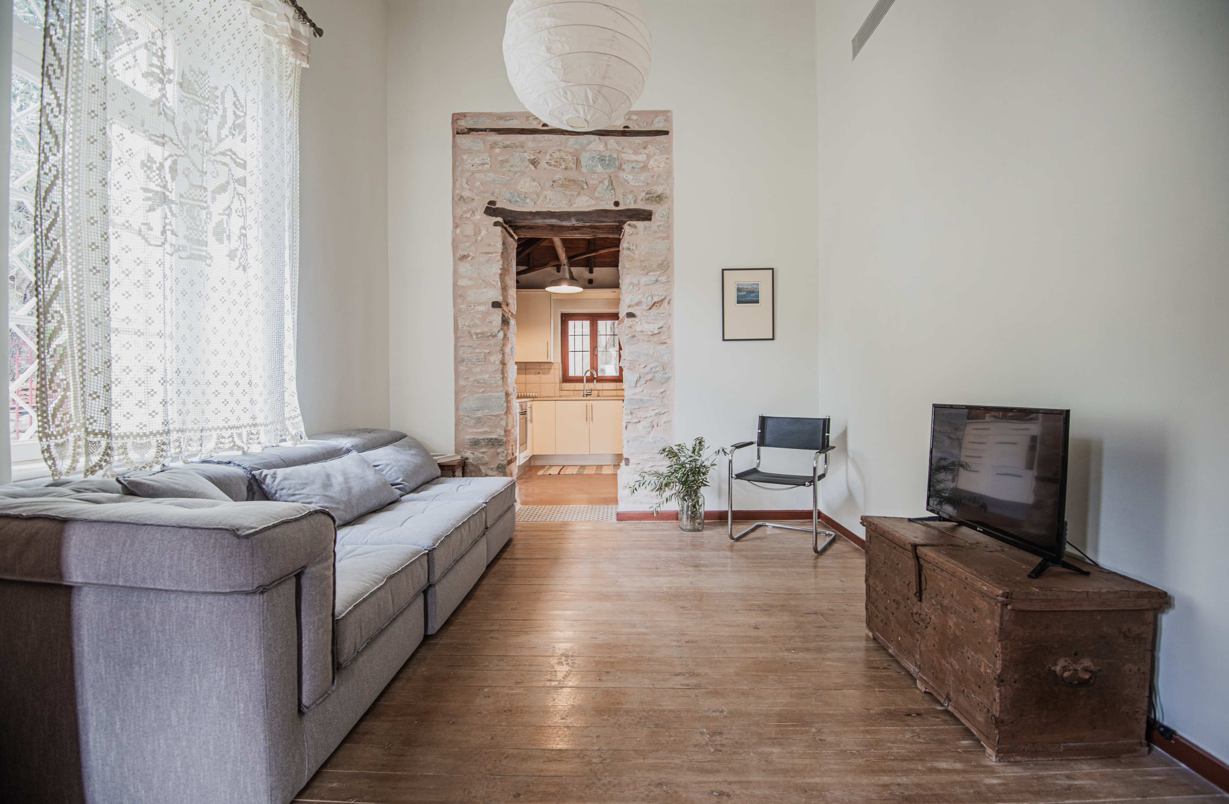 The stone archway and sofa at Pelion Muse