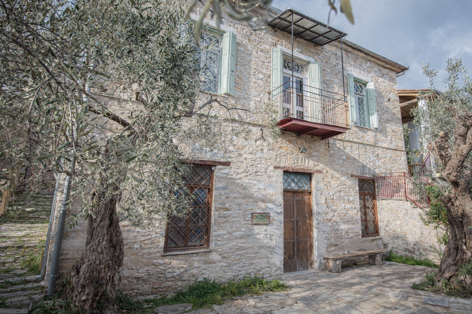 The exterior of Pelion Muse, a restored 1924 stone house in Ano Gatzea, Pelion